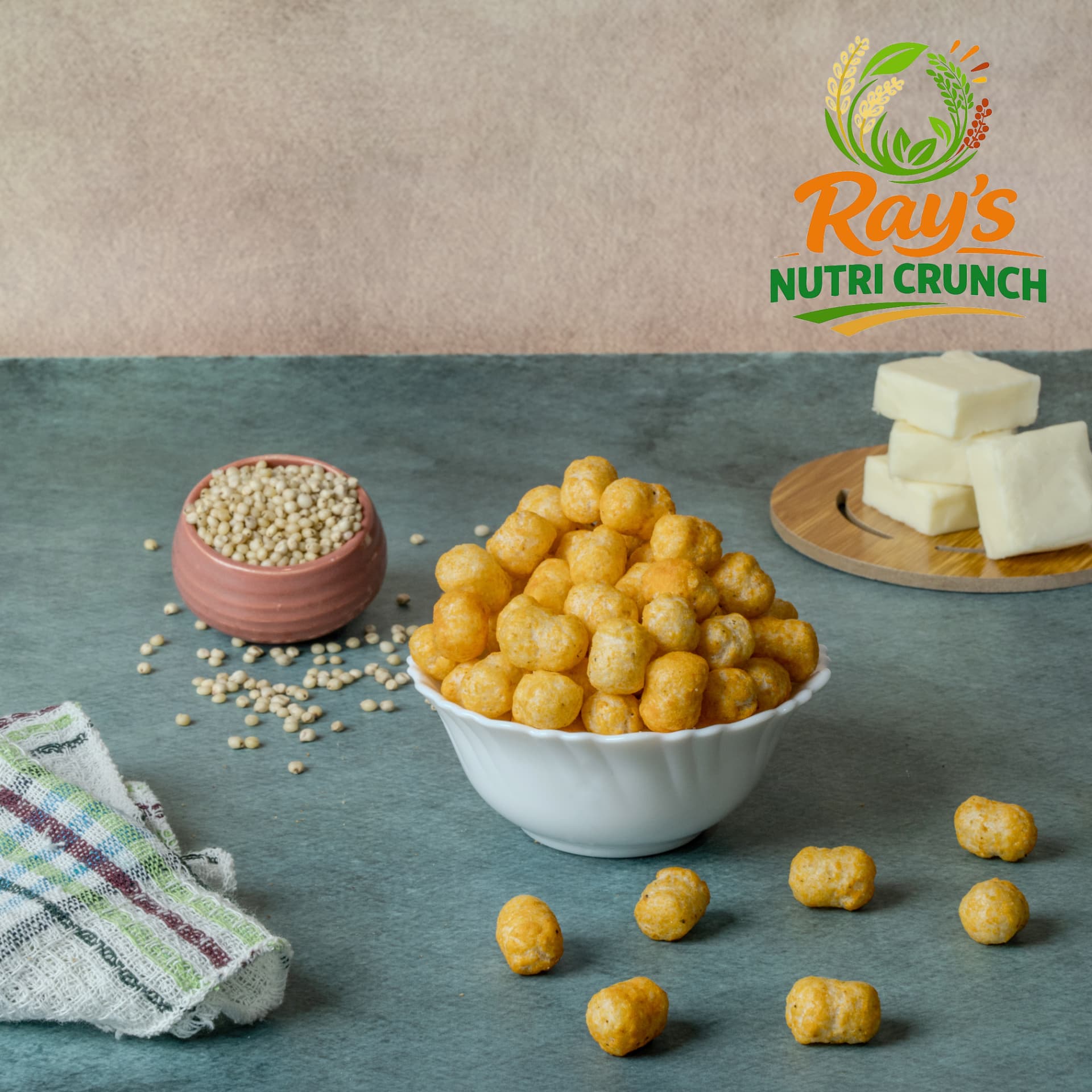 Cheese flavoured millet snack balls in a white bowl