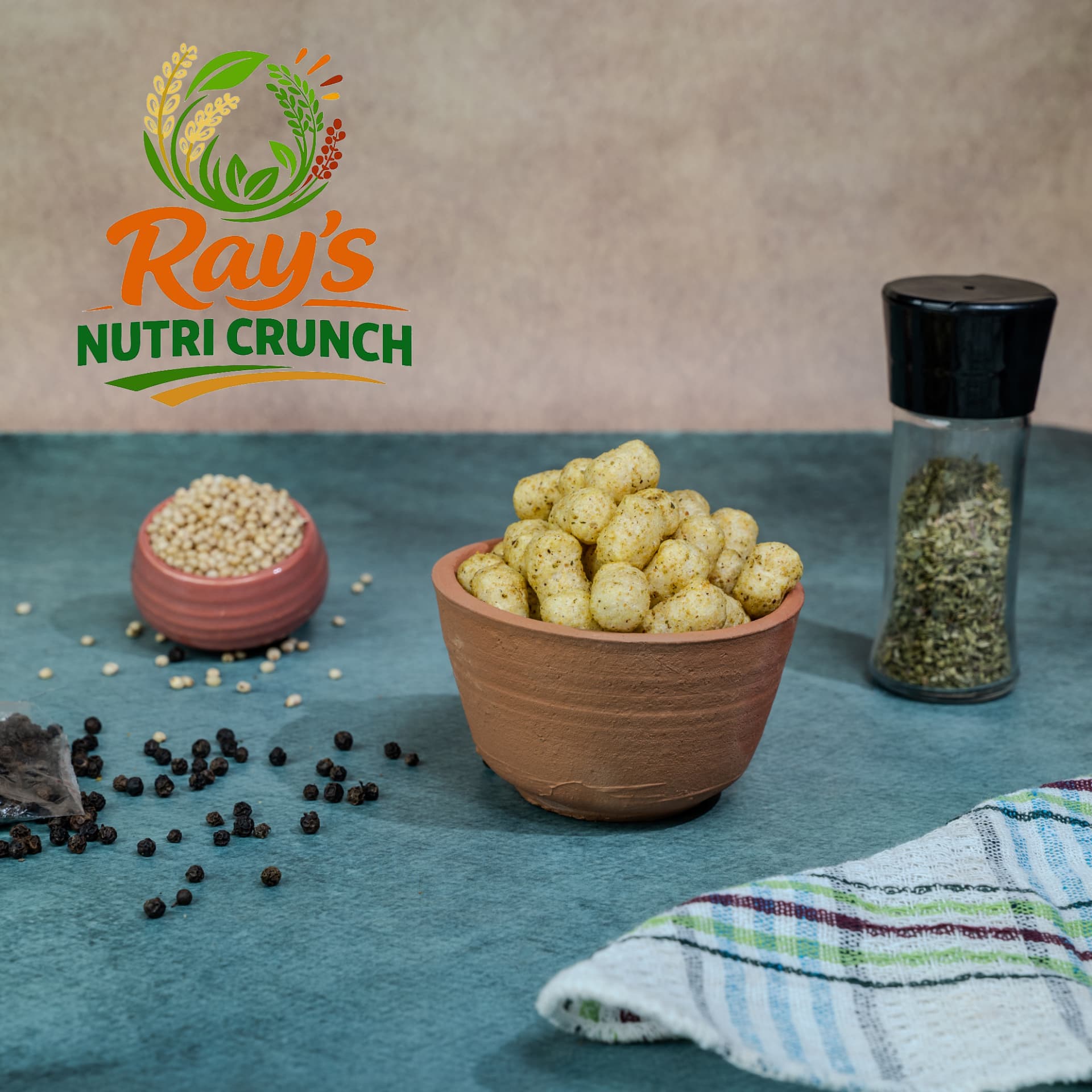 Herb and pepper millet snack balls in a clay bowl