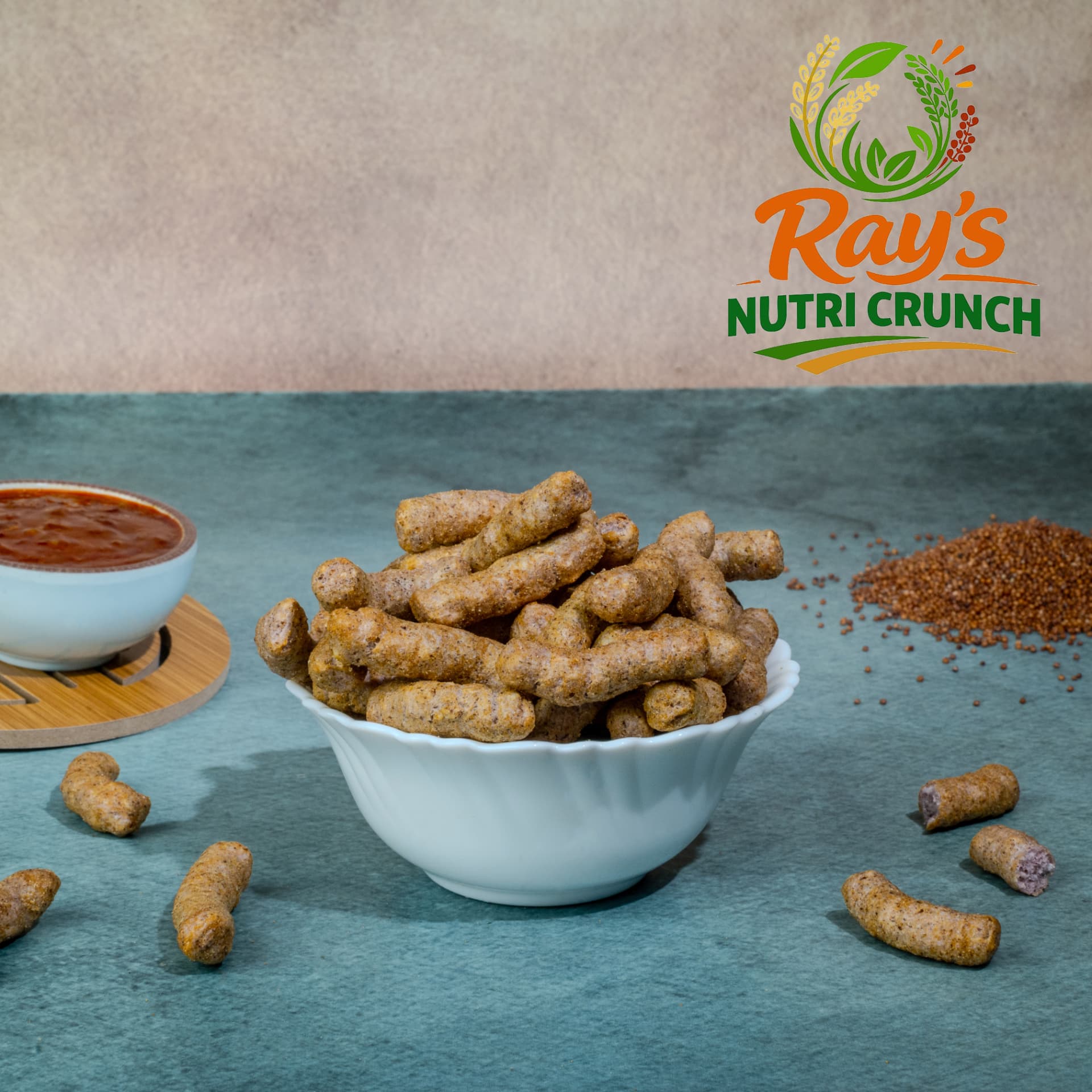 Crunchy millet sticks in a white bowl with chilli dip
